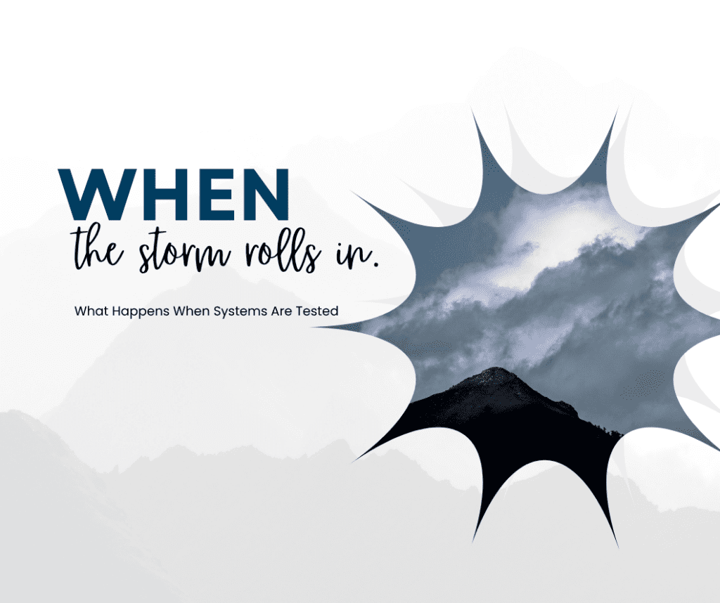 a picture of a mountain top with storm clouds rolling in a starburst shaped frame.