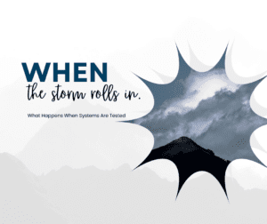 a picture of a mountain top with storm clouds rolling in a starburst shaped frame.