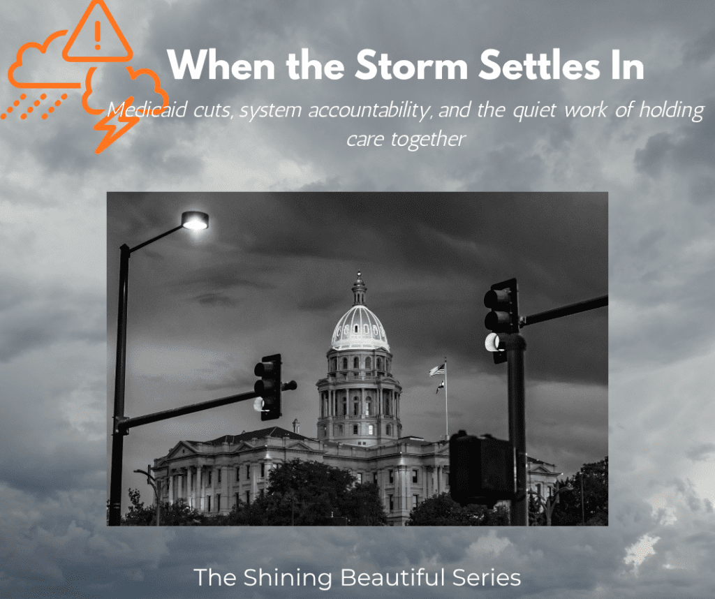 A black and white photo of the Colorado State Capitol of a stormy night.