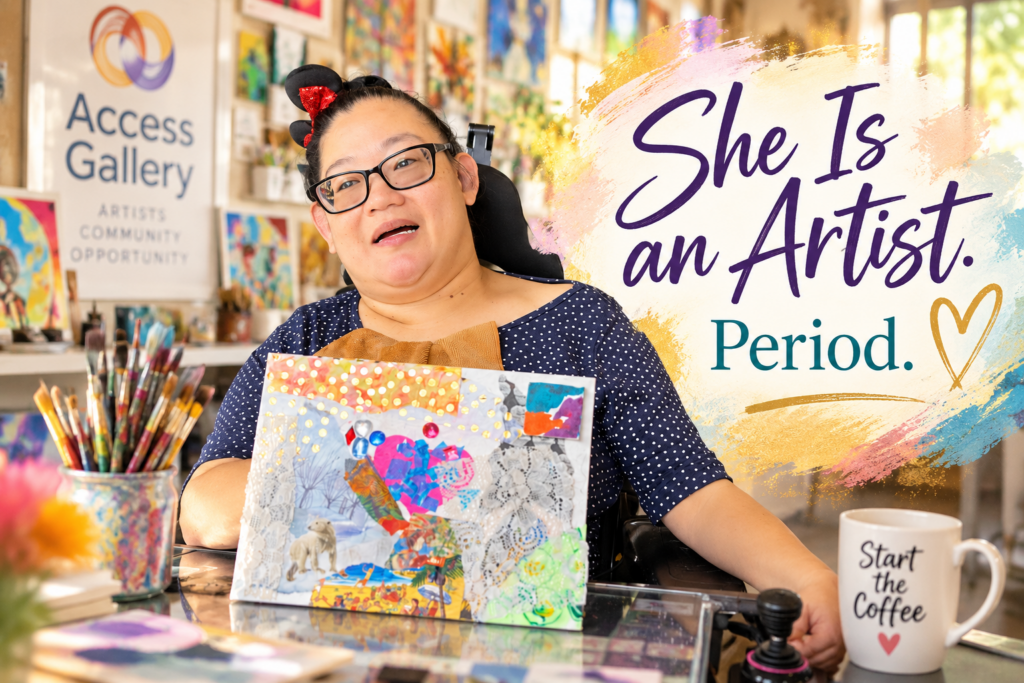 Artist Mikelle Learned, a woman of Asian features is in a wheelchair in an art gallery holding up her newest work of art.